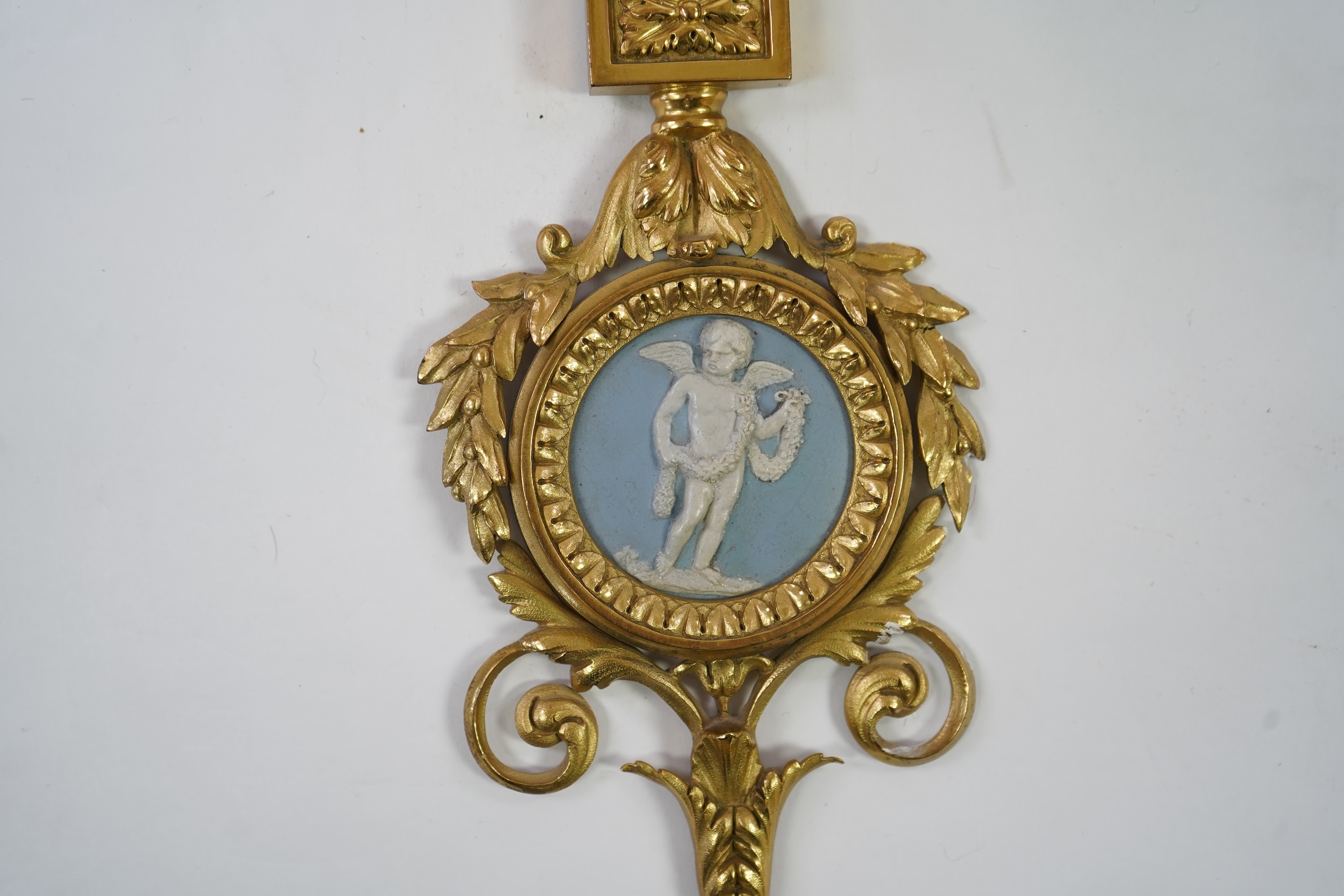 A set of four Adam style ormolu and jasper ware mounted wall appliques, early 20th century